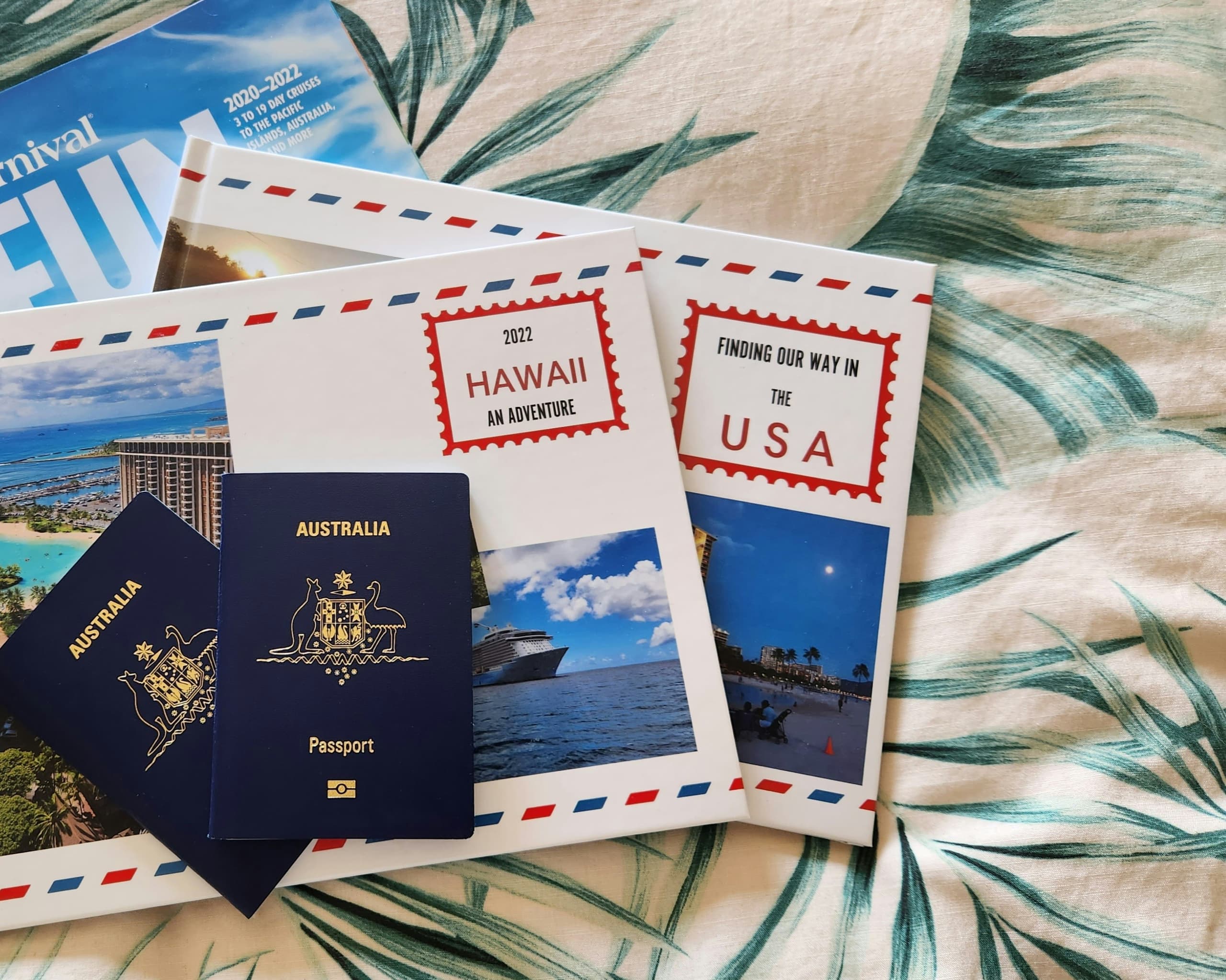 Passports and printed travel albums on a table